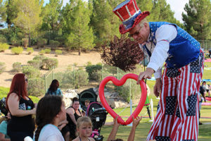 Man on stilts making ballon things for Southern Highlands private golf community of Las Vegas Nevada foundation