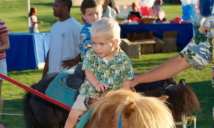 Memorial Day BBQ child riding pony at Southern Highlands Private Golf Community of Las Vegas Nevada